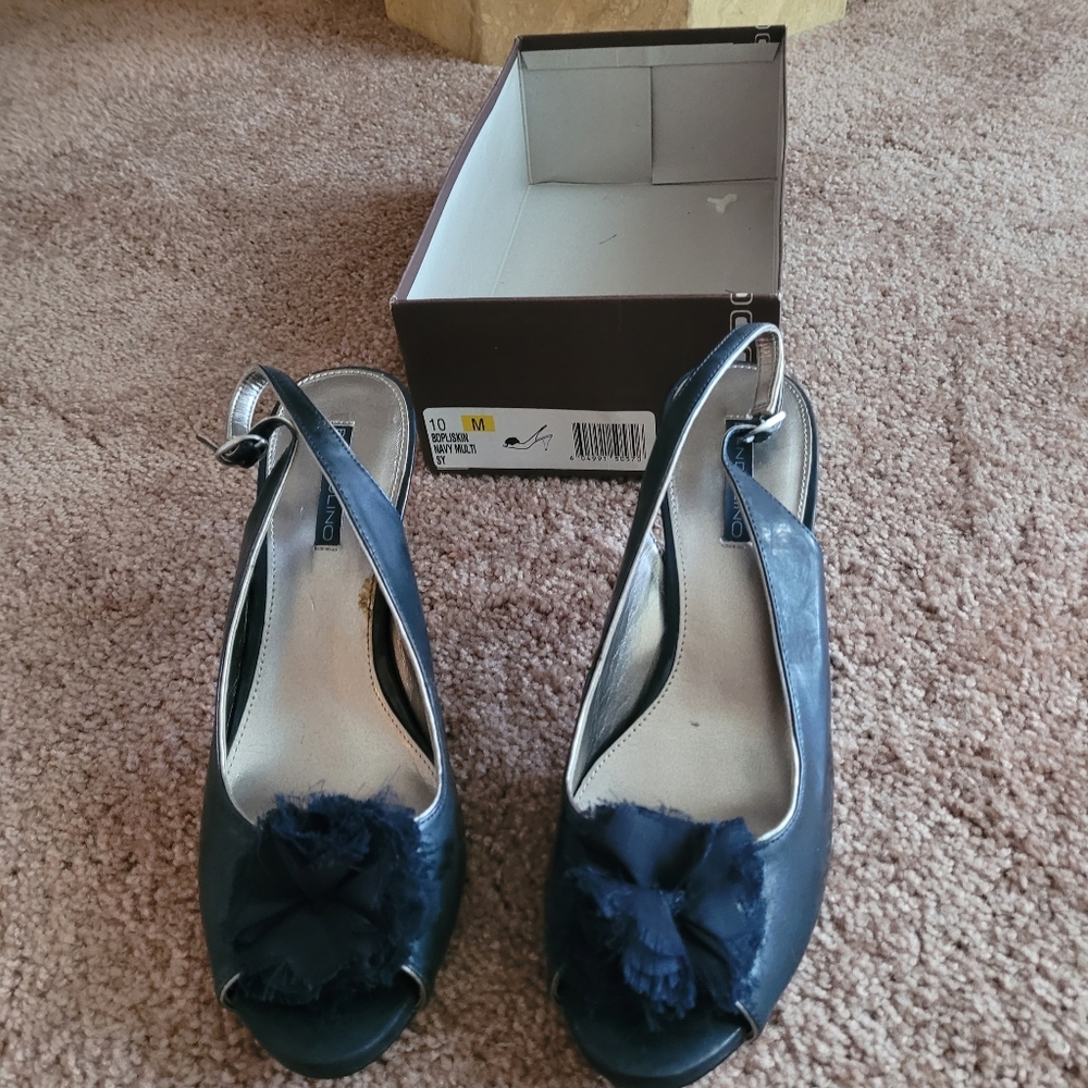 Brand new women's navy blue slingback heels.